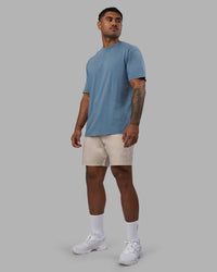 Man wearing Base FLXCotton Tee Oversized - Elemental Blue Washed | Model:Xav | Size:L