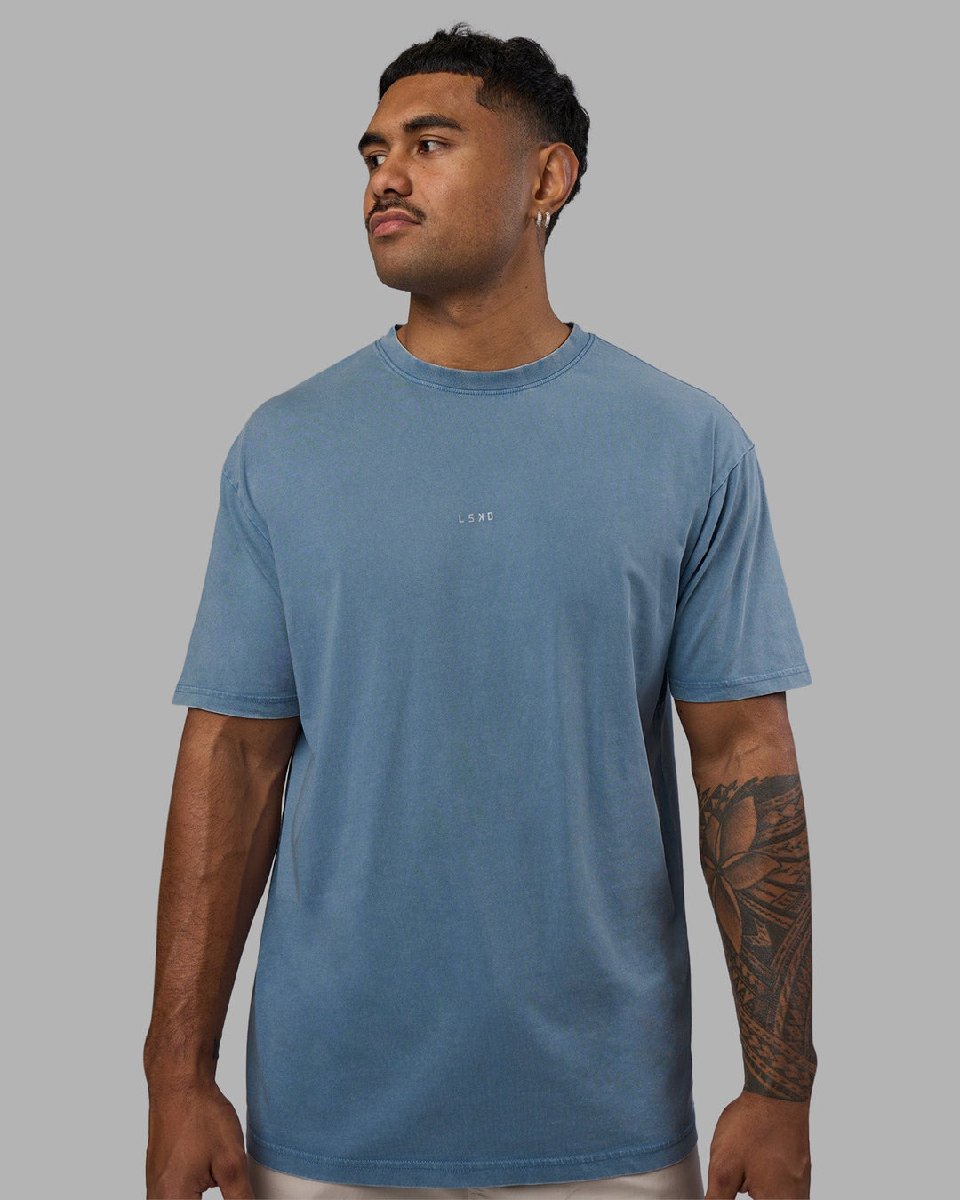 Man wearing Base FLXCotton Tee Oversized - Elemental Blue Washed | Model:Xav | Size:L