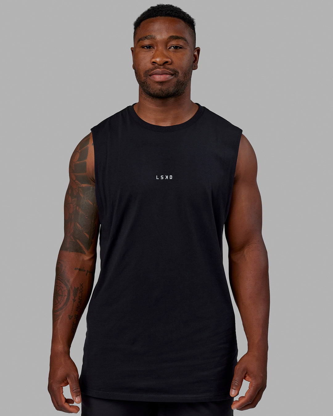 Man wearing Base FLXCotton Tank - Black | Model:Sam | Size:L