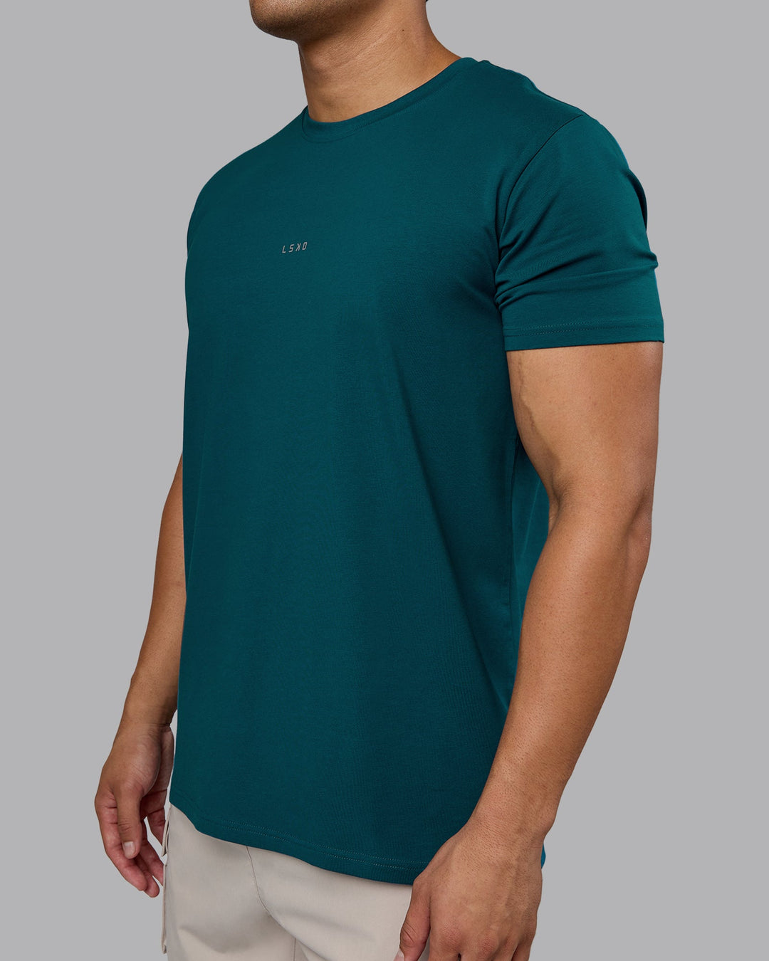 Man wearing Base FLXCotton Tee - Blue Coral | Model:Kaelyb | Size:L