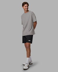 Man wearing Base FLXCotton Tee Oversized - Circular-Grey  Model:Brandon | Size:L