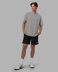 Man wearing Base FLXCotton Tee Oversized - Circular-Grey  Model:Brandon | Size:L