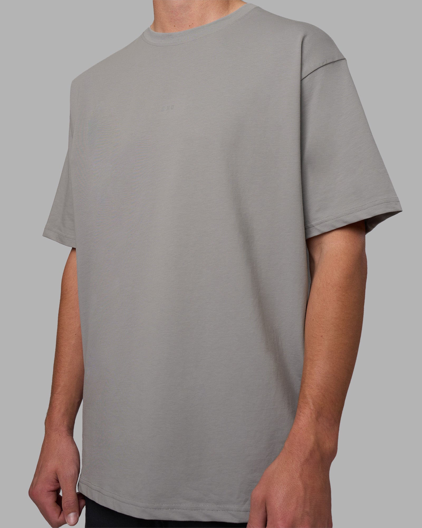 Man wearing Base FLXCotton Tee Oversized - Circular-Grey  Model:Brandon | Size:L