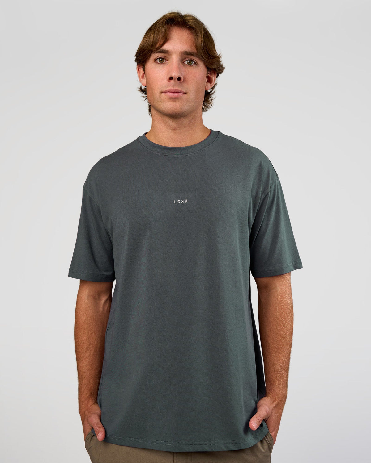 Man wearing Base FLXCotton Tee Oversized - Dark Slate | Model:Marcus | Size:L