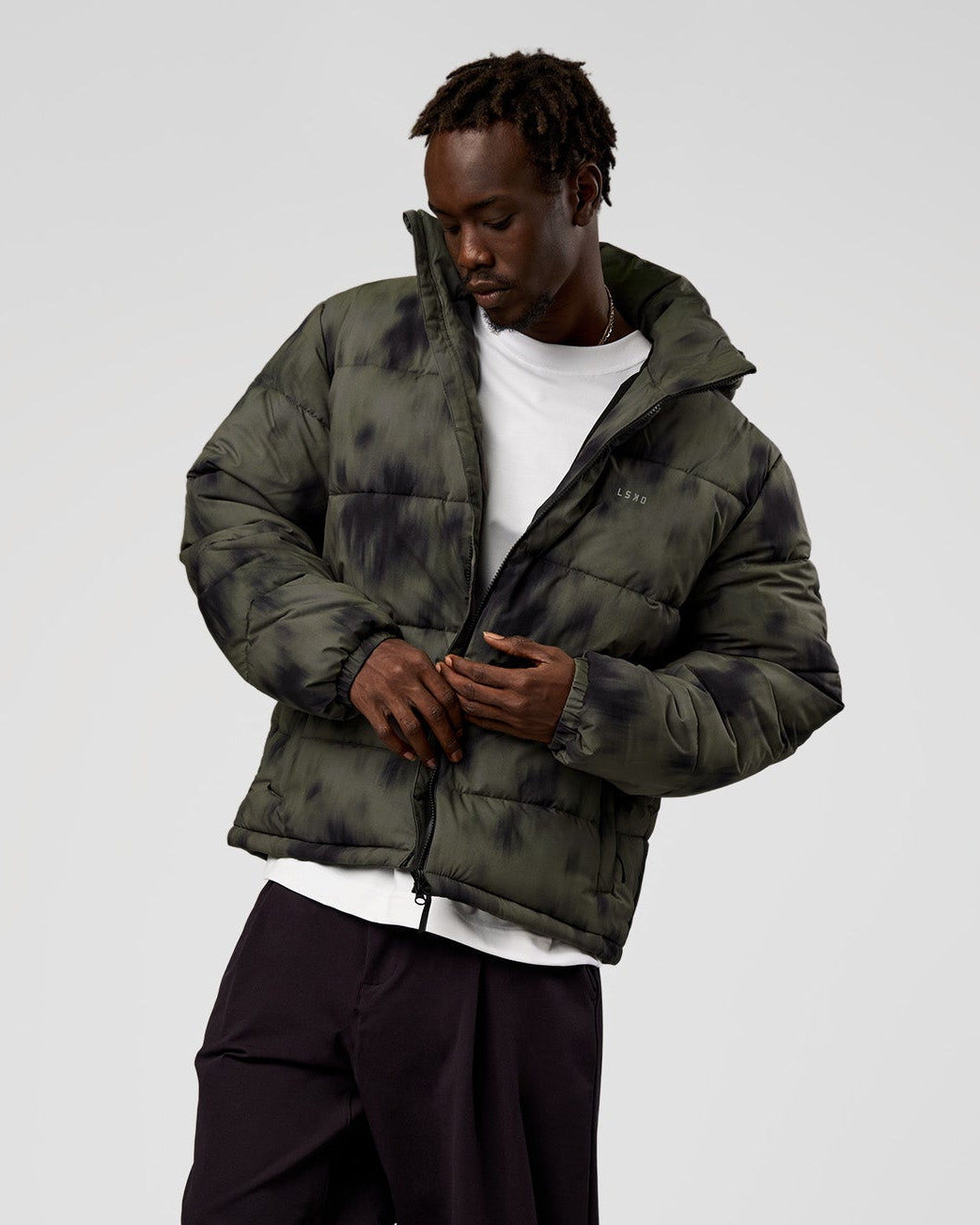 Man wearing Base Puffer Jacket - Camo Washed Walnut Grey | Model:Okello | Size:L - view 1