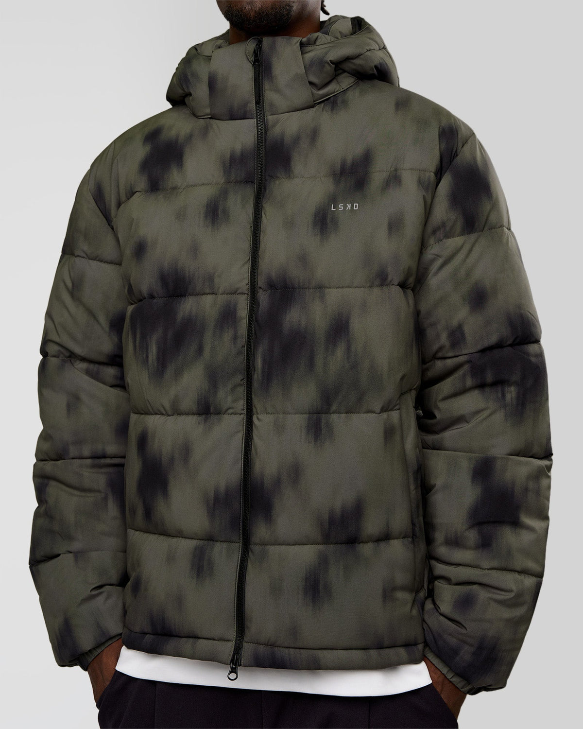Man wearing Base Puffer Jacket - Camo Washed Walnut Grey | Model:Okello | Size:L - view 2