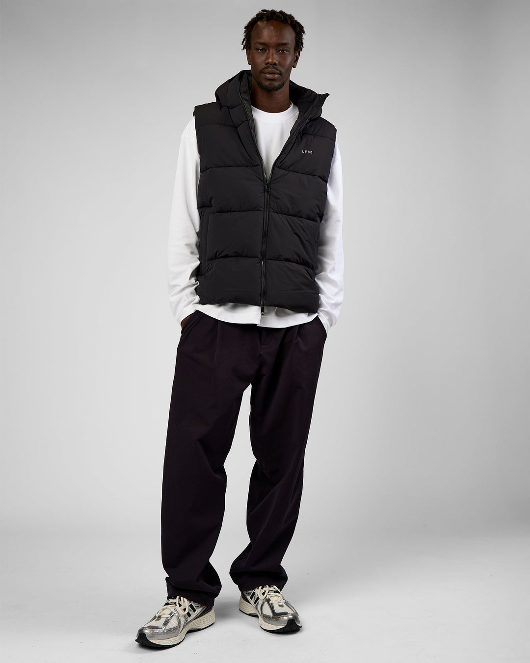 Man wearing Base Puffer Vest - Black | Model:Okello | Size:L