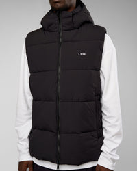 Man wearing Base Puffer Vest - Black | Model:Okello | Size:L