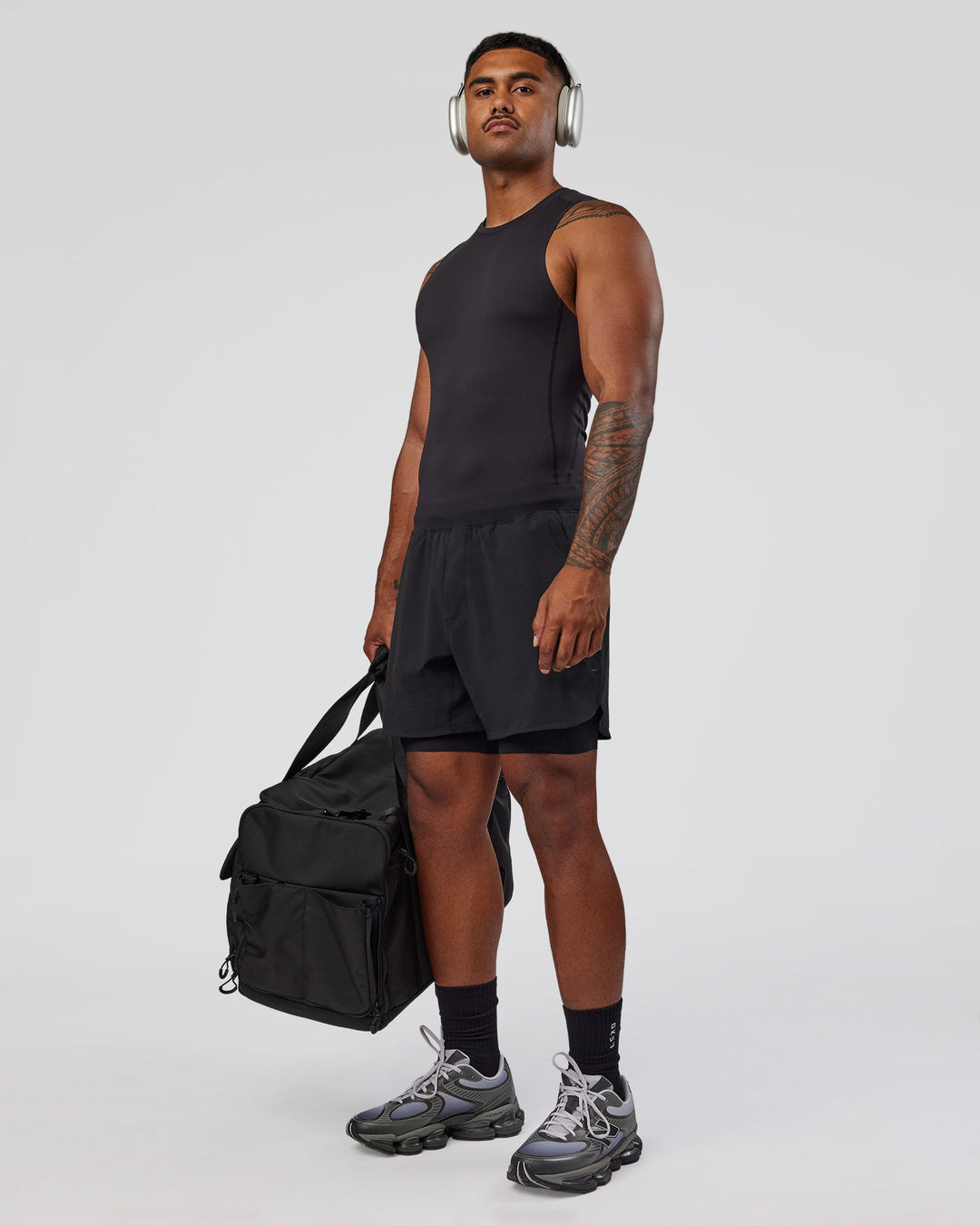 Man wearing BaseTech 8" Shorts - Black | Model:Xav | Size:L