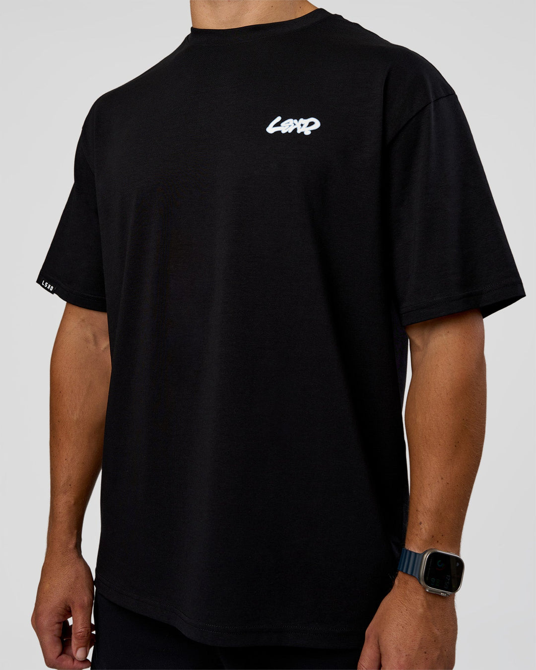 Man wearing Break Through FLXCotton Oversized Tee - Black-Open Air | Model:Jaiden | Size:L