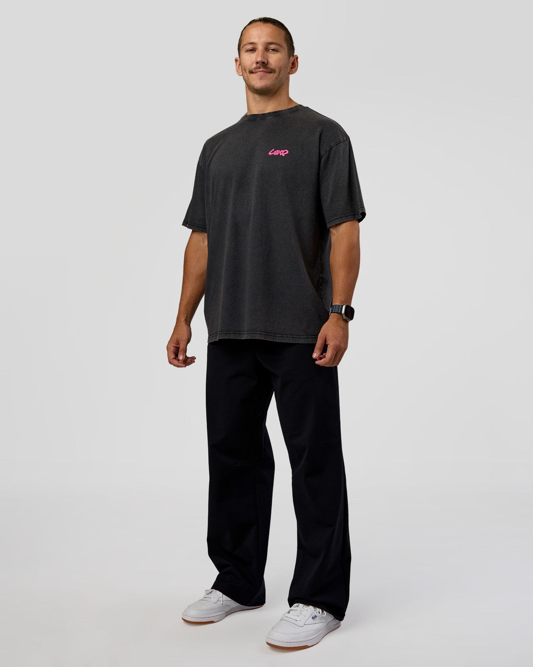 Man wearing Break Through FLXCotton Oversized Tee - Black-Plum Caspia | Model:Jaiden | Size:L