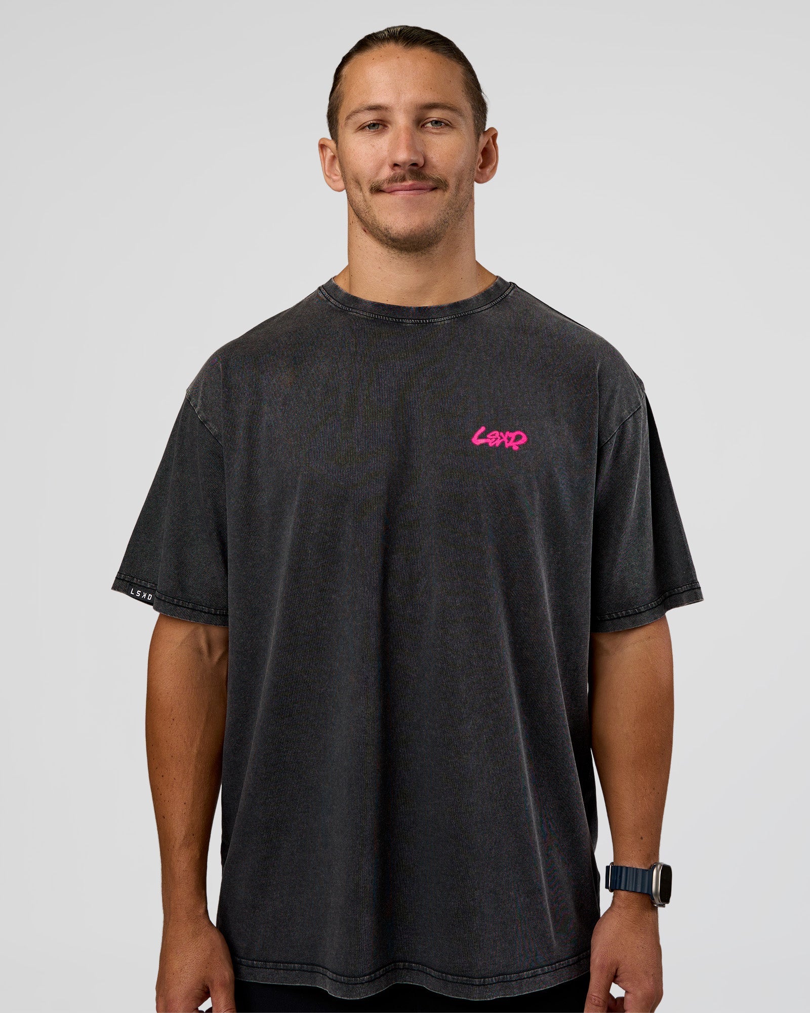 Man wearing Break Through FLXCotton Oversized Tee - Black-Plum Caspia | Model:Jaiden | Size:L