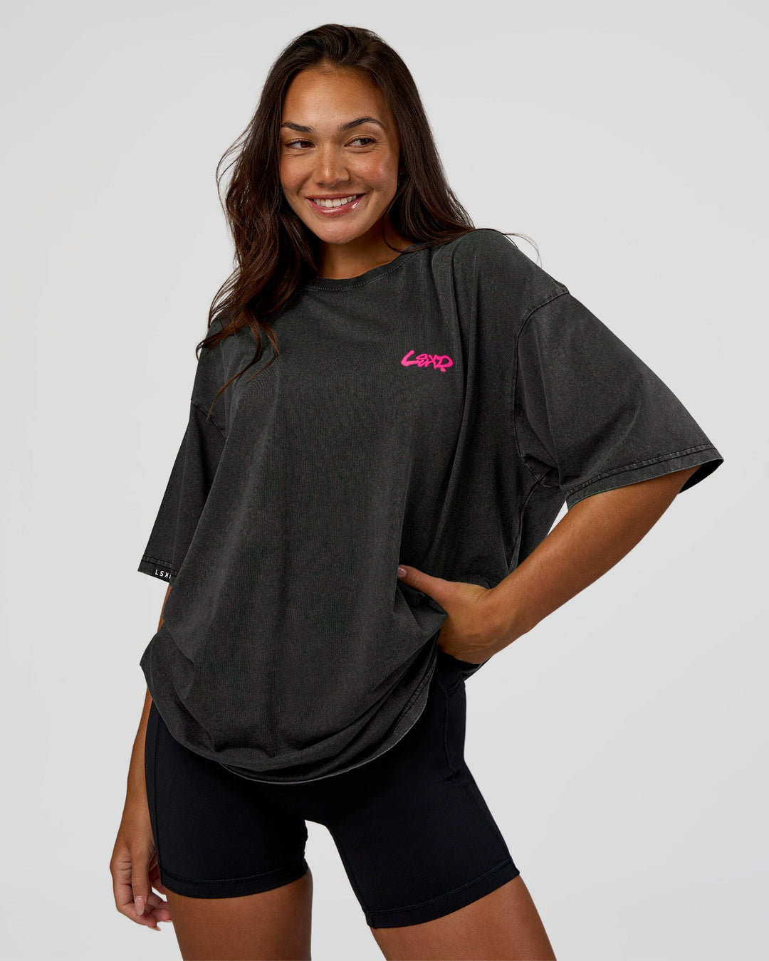 Woman wearing Break Through FLXCotton Oversized Tee - Black-Plum Caspia | Model:Kirstyn | Size:L