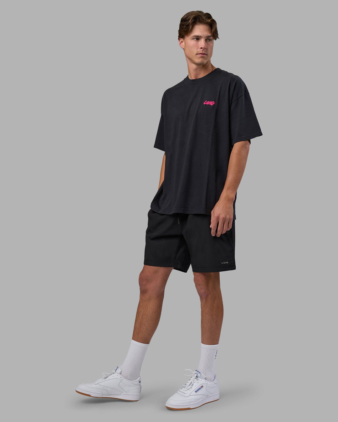 Man wearing Break Through Heavyweight Oversized Tee - Black Washed-Plum Caspia | Model:Brandon | Size:L