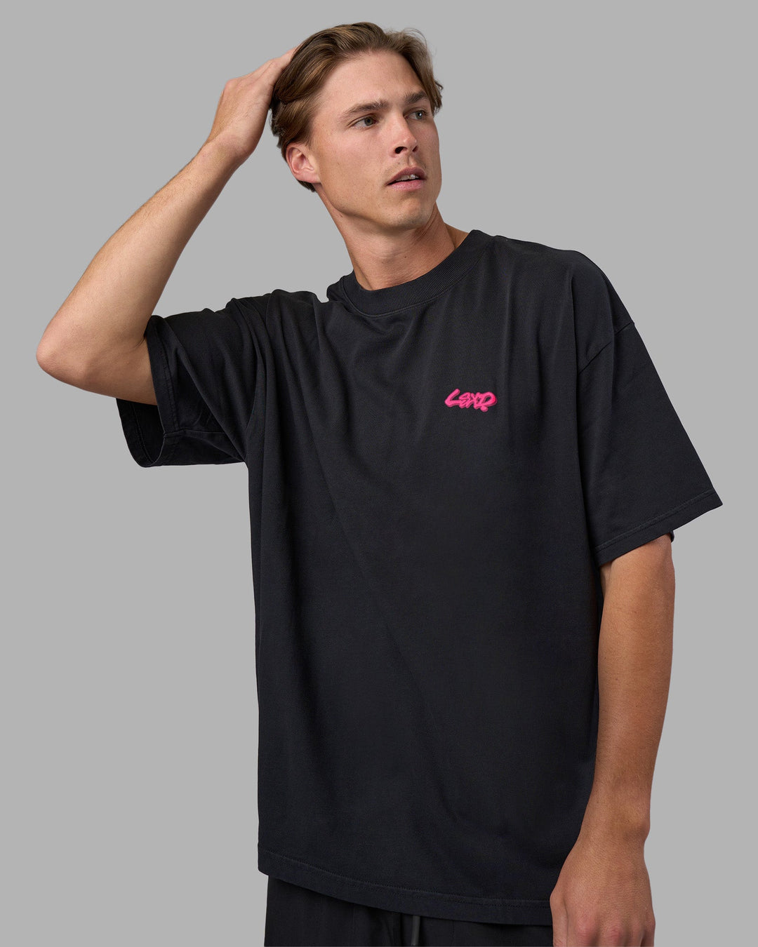 Man wearing Break Through Heavyweight Oversized Tee - Black Washed-Plum Caspia | Model:Brandon | Size:L