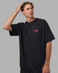 Man wearing Break Through Heavyweight Oversized Tee - Black Washed-Plum Caspia | Model:Brandon | Size:L