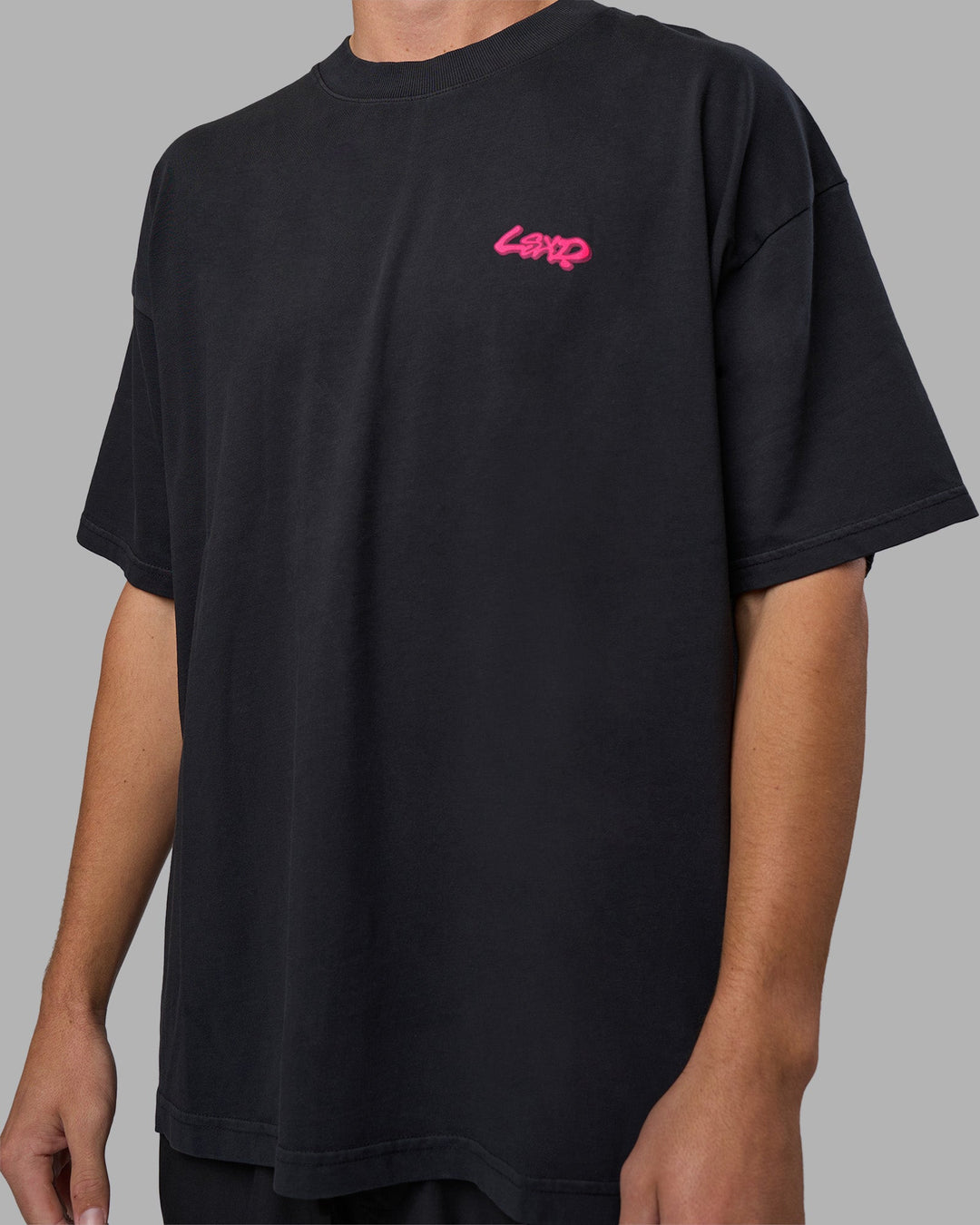 Man wearing Break Through Heavyweight Oversized Tee - Black Washed-Plum Caspia | Model:Brandon | Size:L