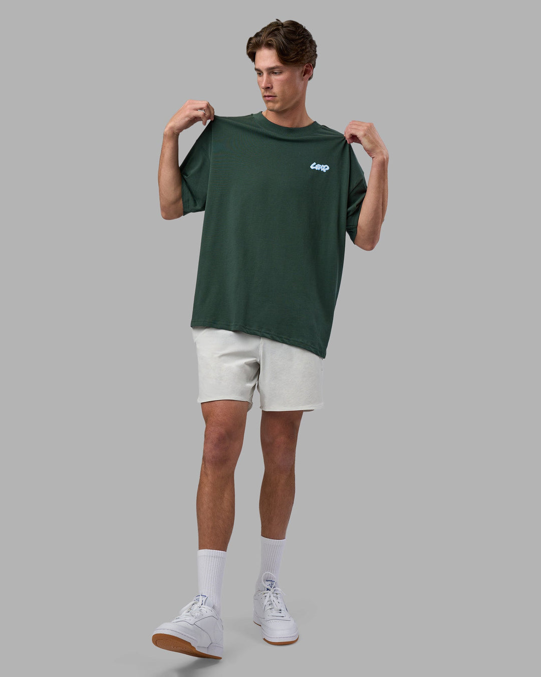 Man wearing Break Through Heavyweight Oversized Tee - Vital Green-Open Air | Model:Brandon | Size:L