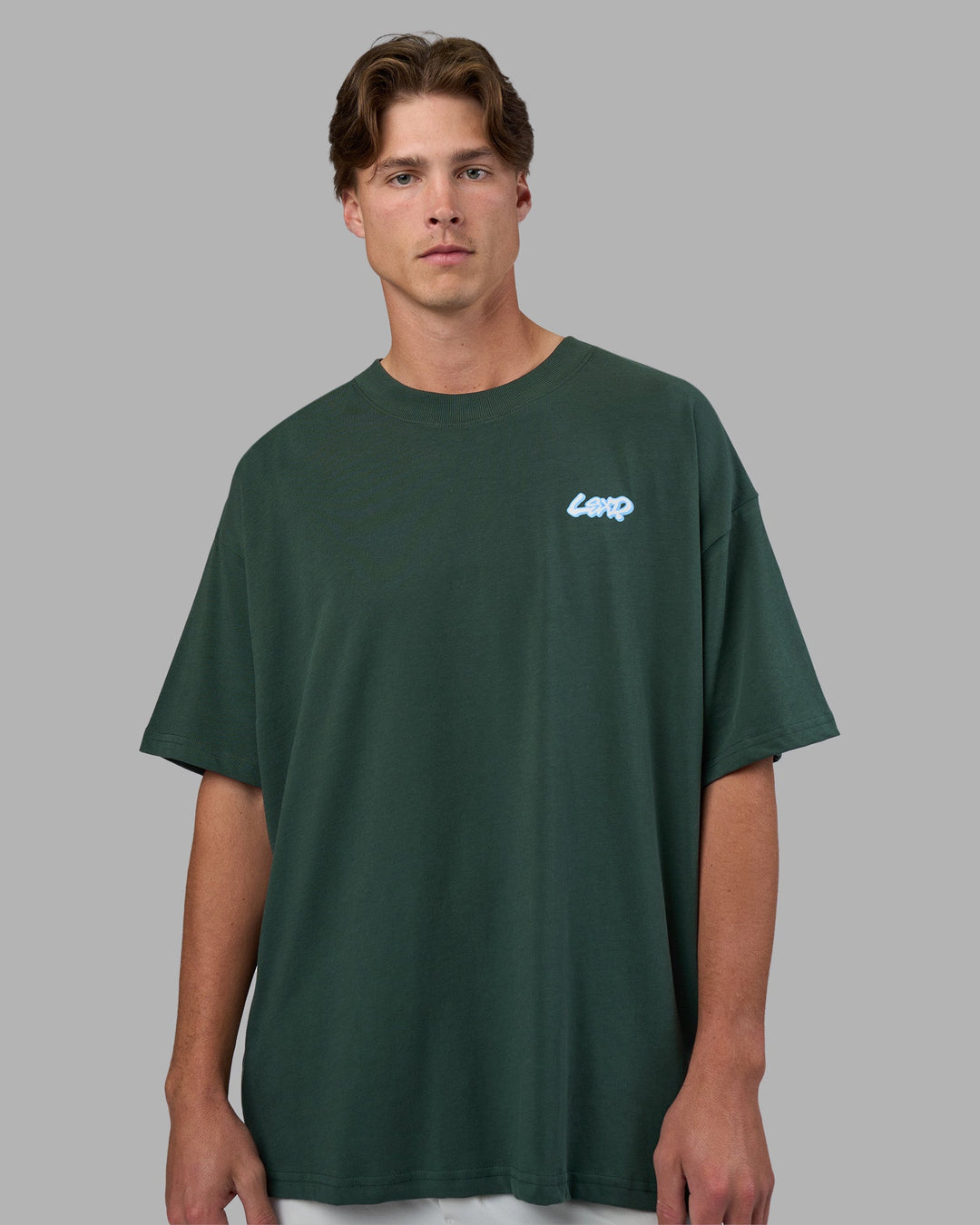 Man wearing Break Through Heavyweight Oversized Tee - Vital Green-Open Air | Model:Brandon | Size:L