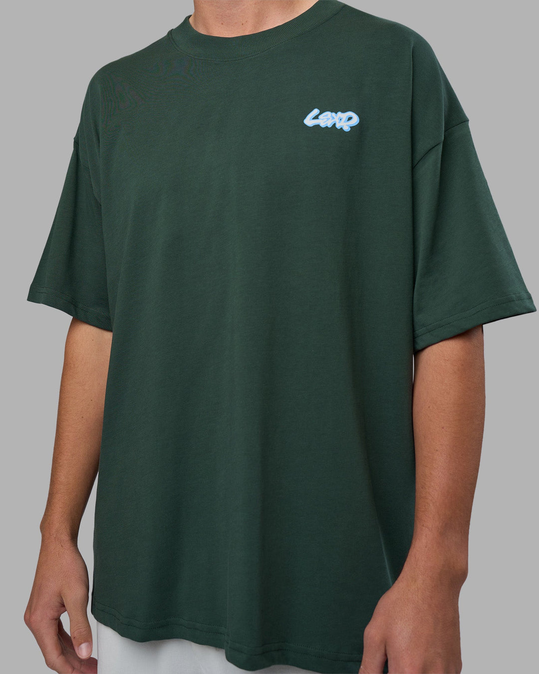 Man wearing Break Through Heavyweight Oversized Tee - Vital Green-Open Air | Model:Brandon | Size:L