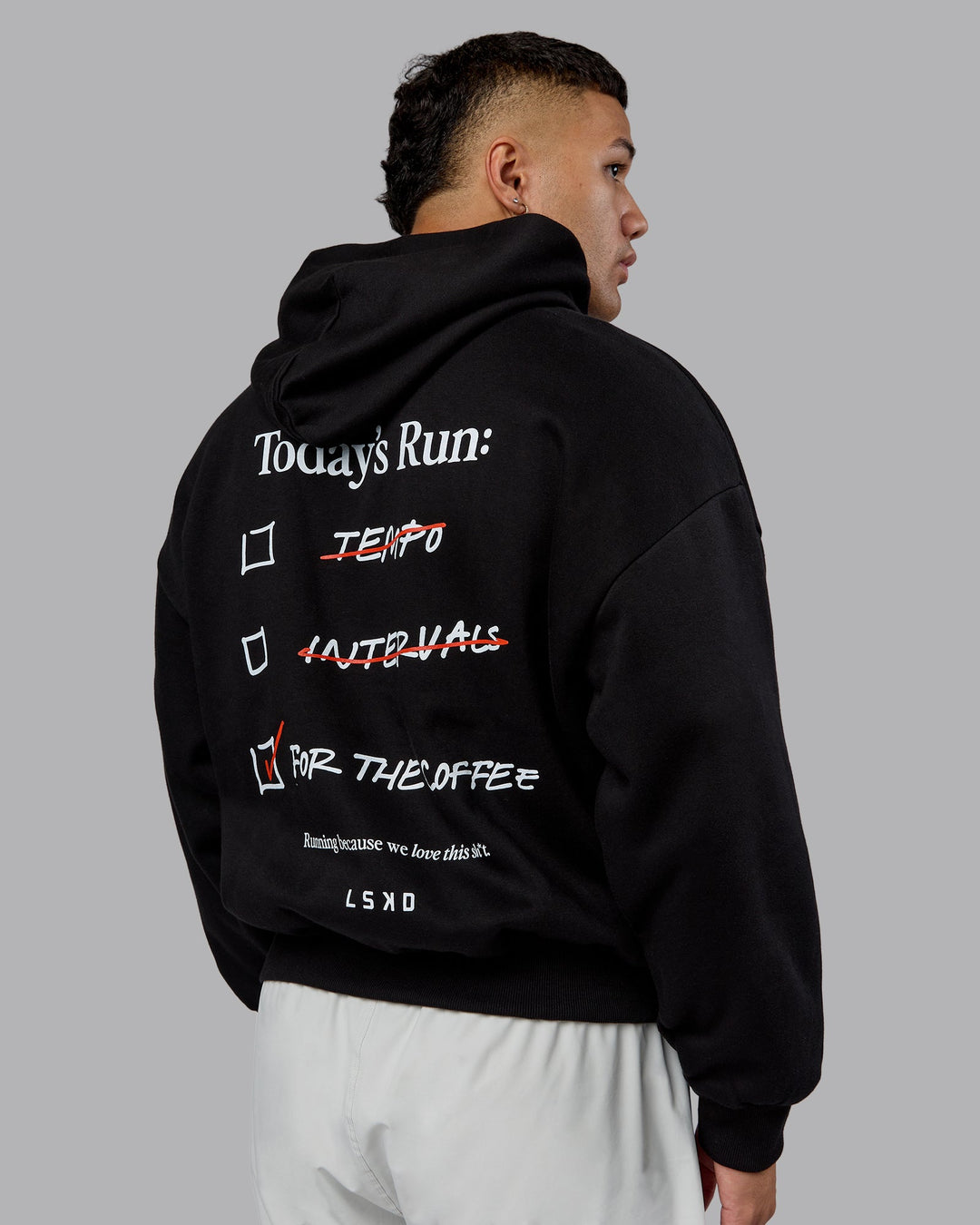 Man wearing Checklist Oversized Hoodie - Black | Model:Kaelyb | Size:L