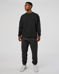 Man wearing Classic Heavyweight FLXCotton Oversized Long Sleeve Tee - Washed Black-Black | Model:Xav | Size:L