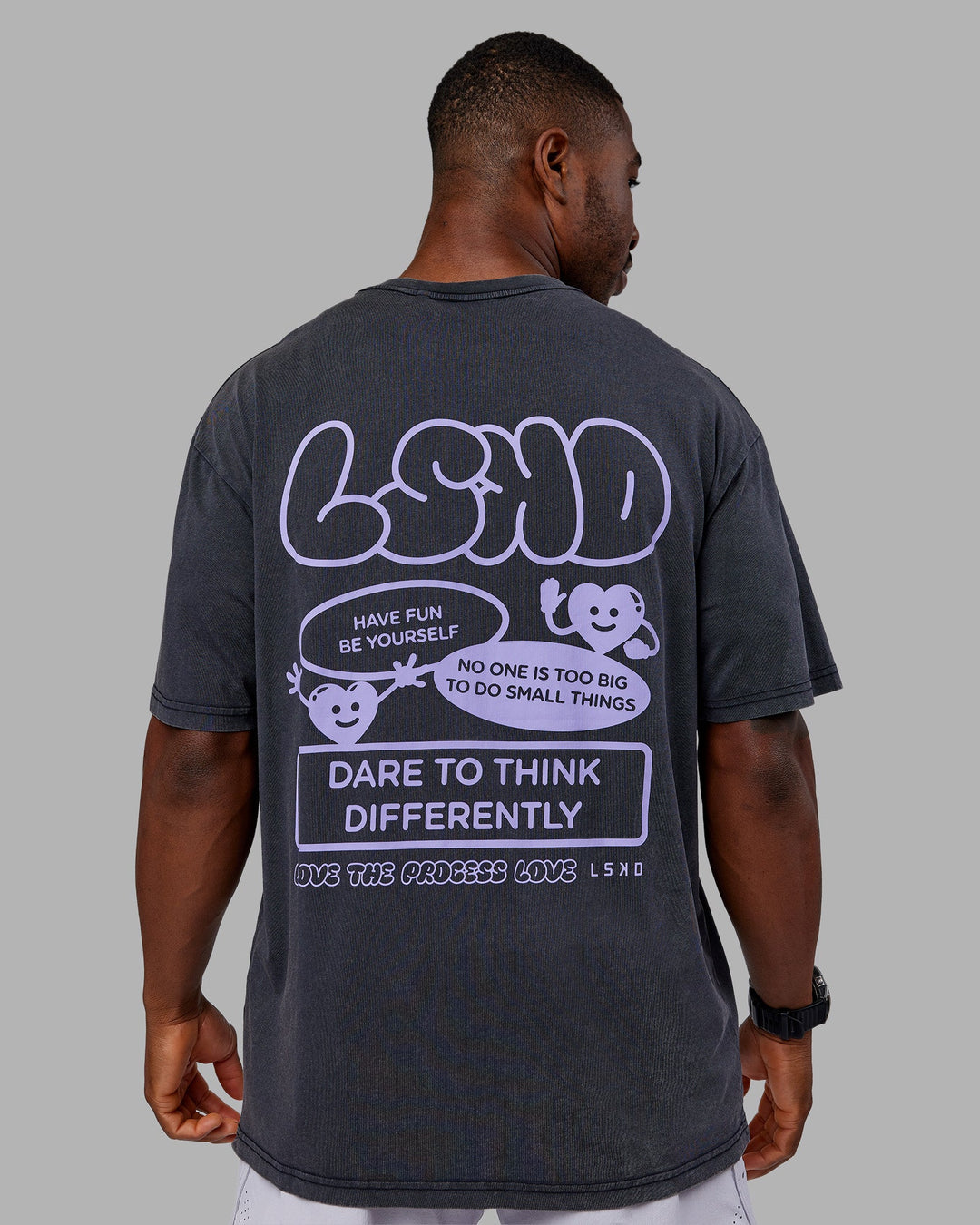 Man wearing Dare To Think FLXCotton Tee Oversize - Black Washed-Violet Ray | Model:Sam | Size:L