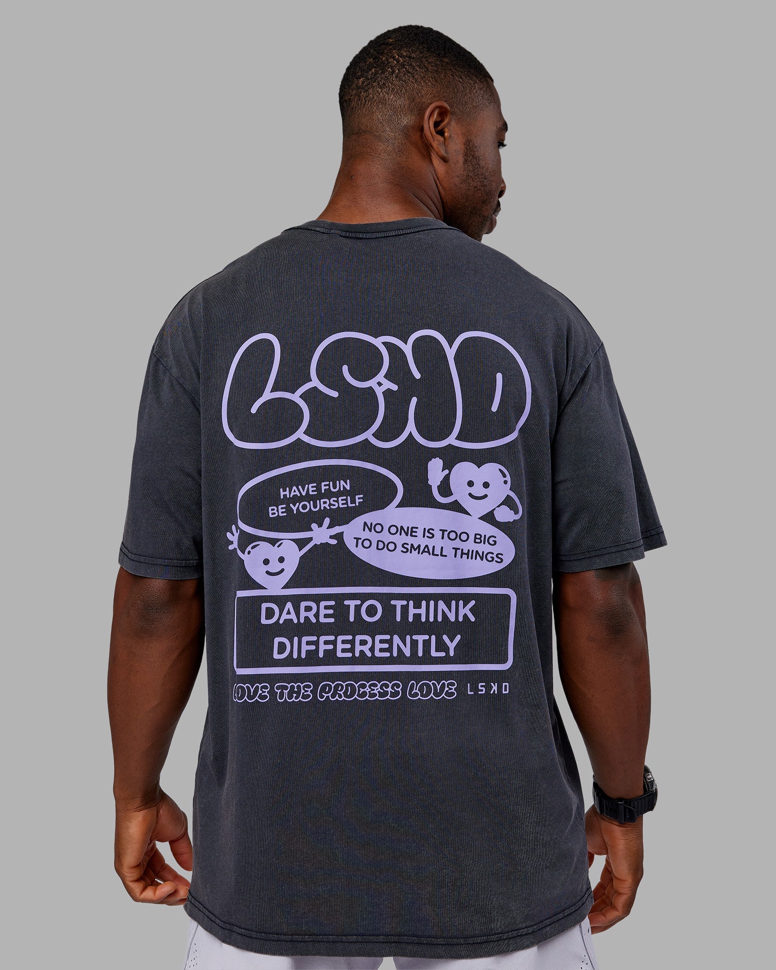Man wearing Dare To Think FLXCotton Tee Oversize - Black Washed-Violet Ray | Model:Sam | Size:L
