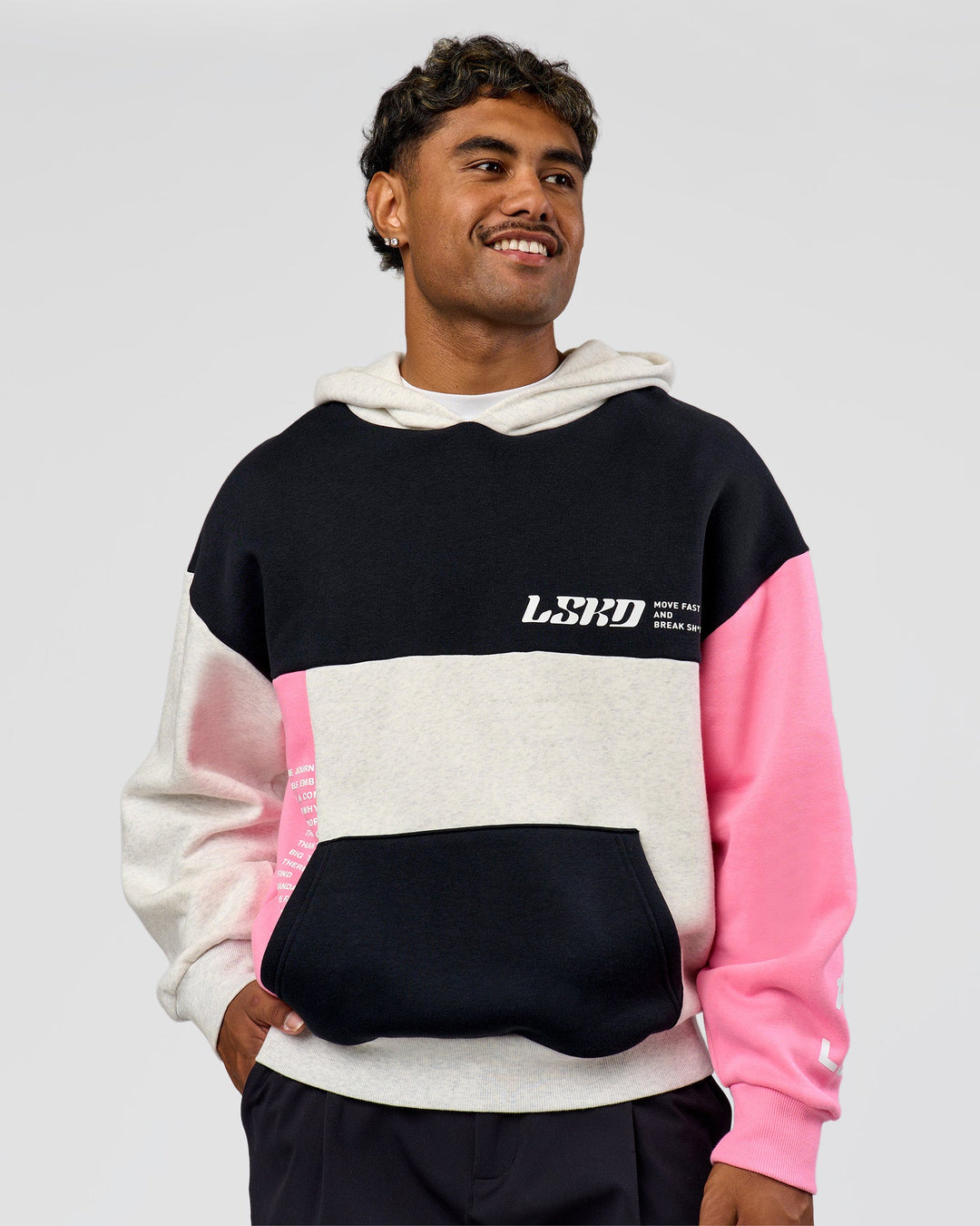 Man wearing Deconstructed Fleece Hoodie - Caviar-Candy Pink-Grey Marl | Model:Xav | Size:L