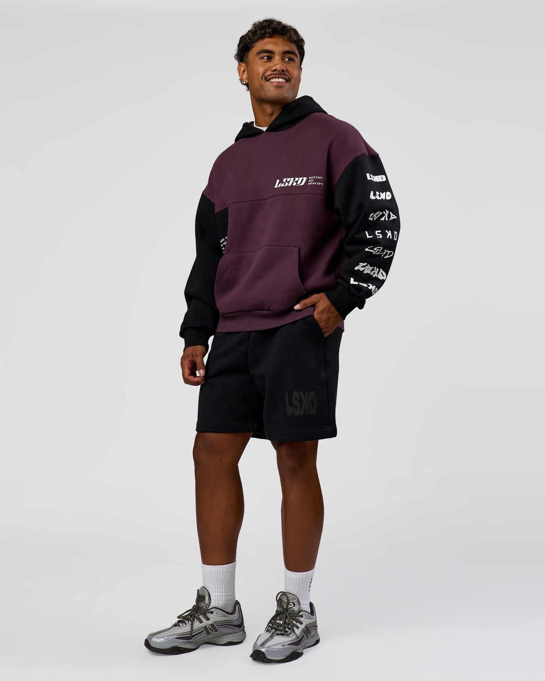 Man wearing Deconstructed Fleece Hoodie - Caviar-Midnight Plum | Model:Xav | Size:L