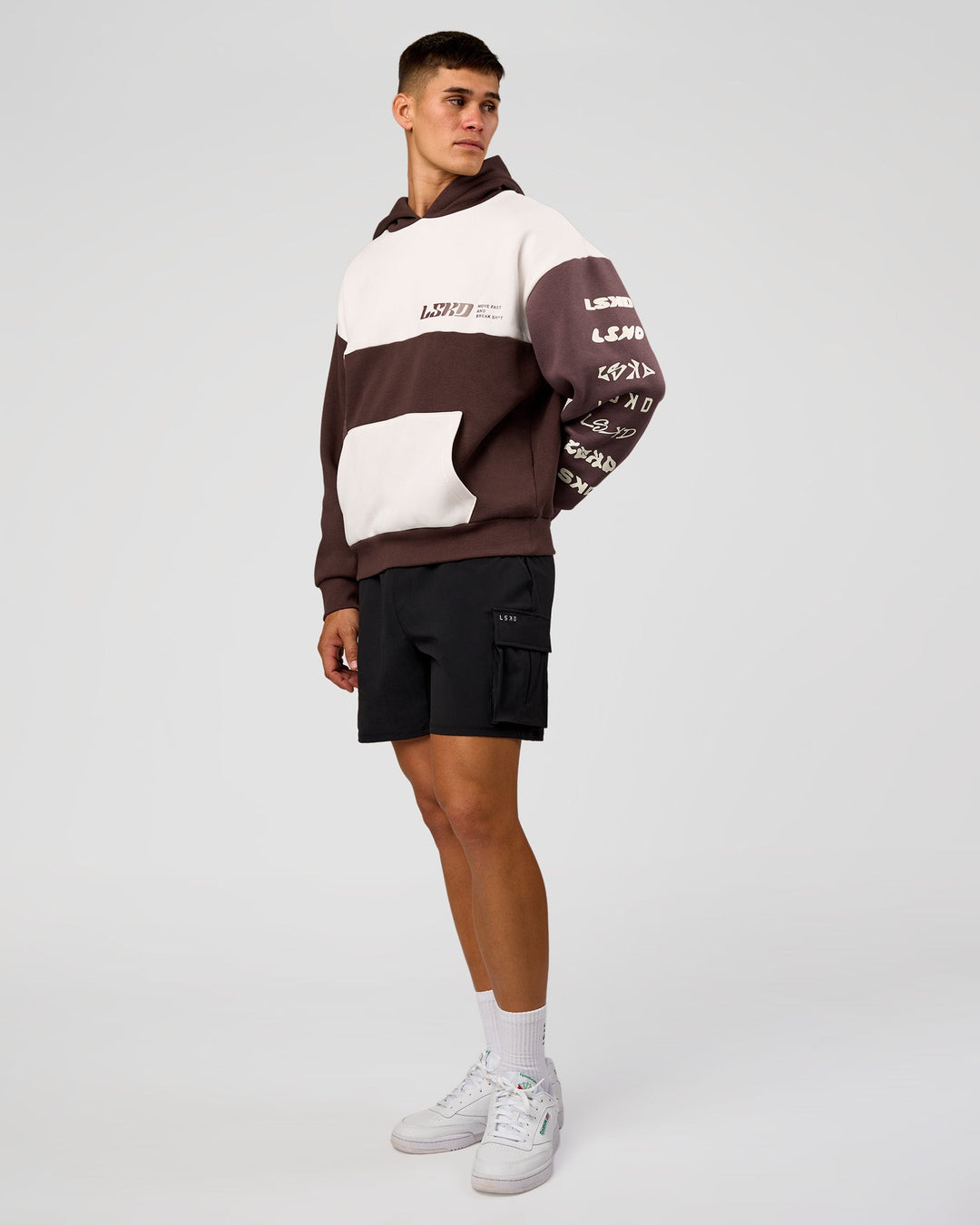 Man wearing Deconstructed Fleece Hoodie - Off White-Cocoa Powder-Choc | Model:Jackson | Size:L
