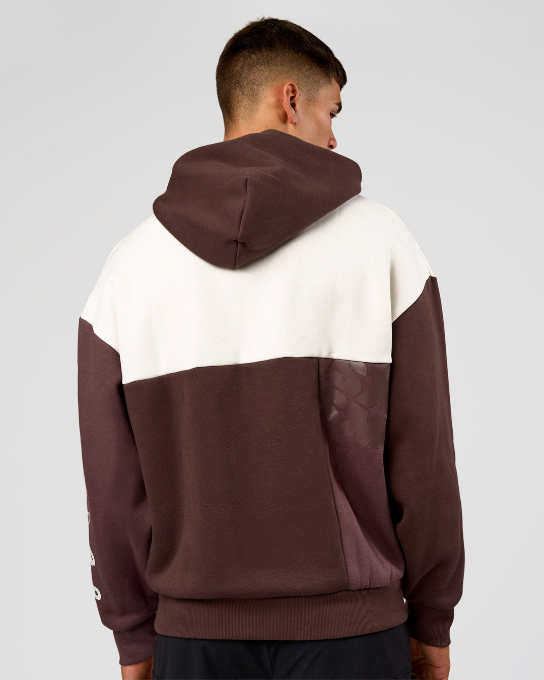 Man wearing Deconstructed Fleece Hoodie - Off White-Cocoa Powder-Choc | Model:Jackson | Size:L