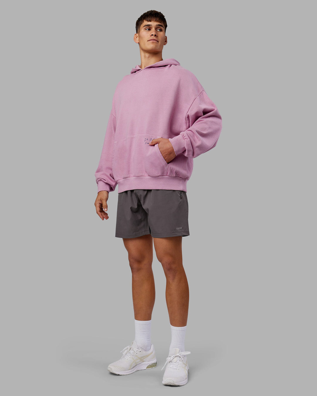 Man wearing ETJ Values Washed Unisex Oversize Hoodie - Bubblegum-Indigo | Model:Jackson | Size:L