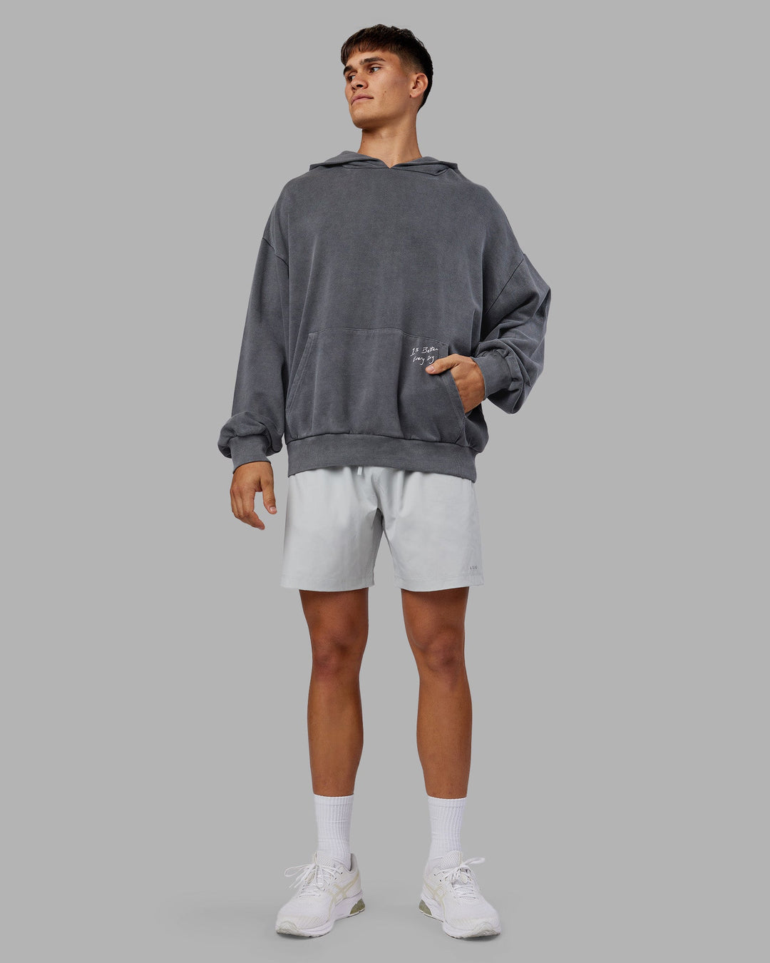 Man wearing ETJ Values Washed Unisex Oversize Hoodie - Dark Storm-Light Bubblegum | Model:Jackson | Size:L