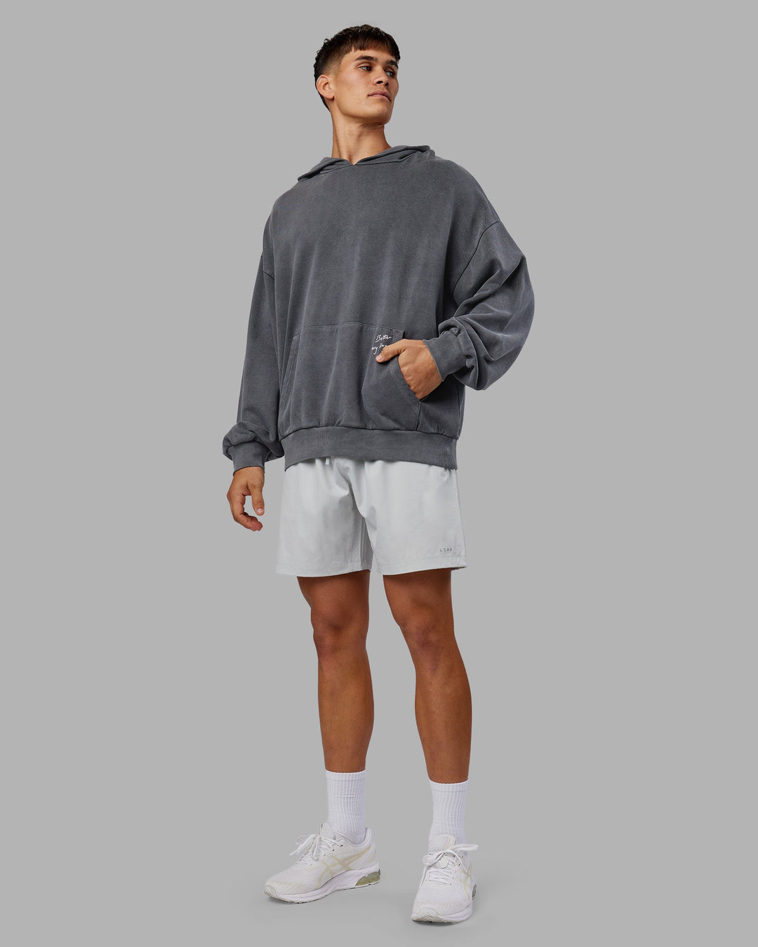 Man wearing ETJ Values Washed Unisex Oversize Hoodie - Dark Storm-Light Bubblegum | Model:Jackson | Size:L
