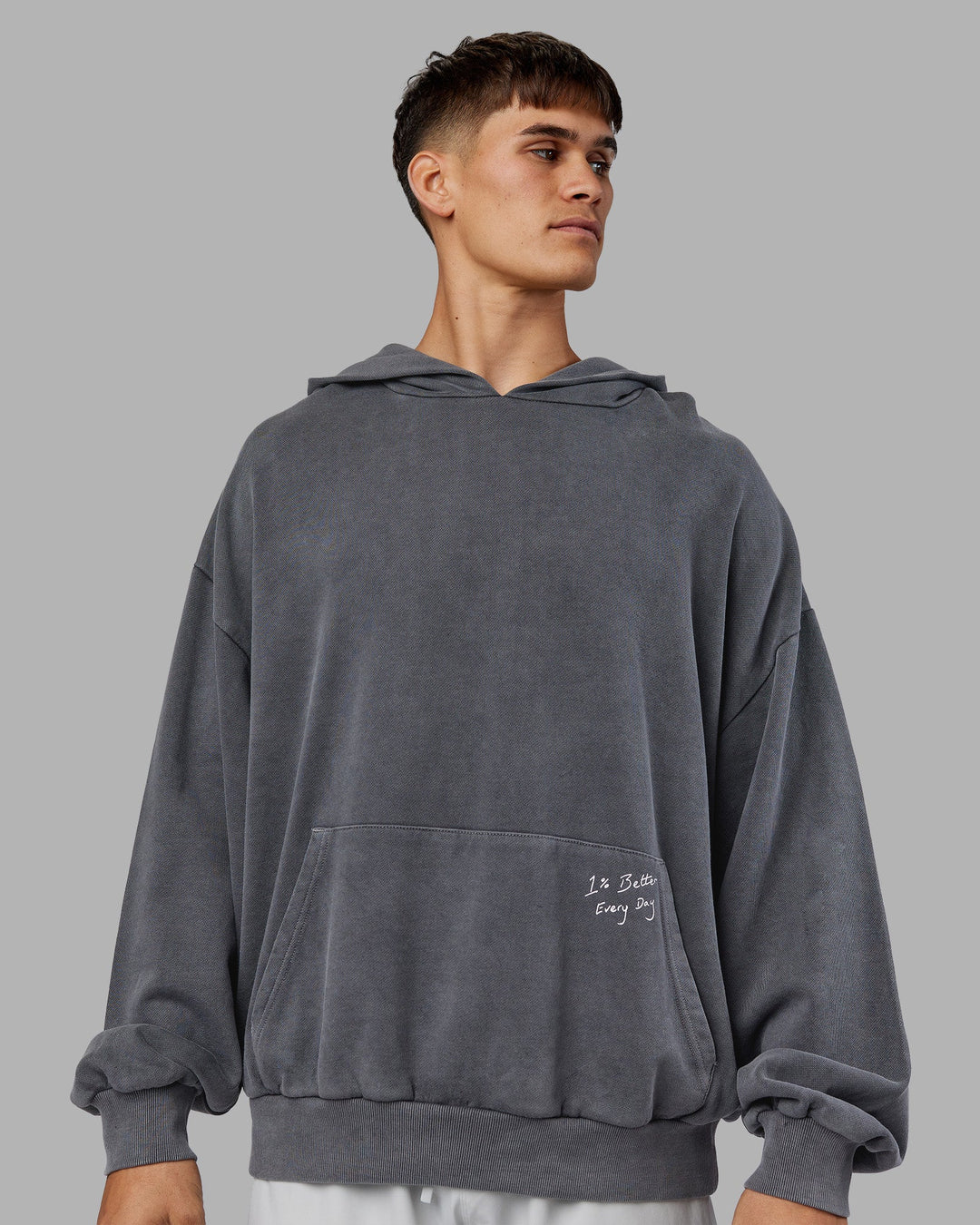 Man wearing ETJ Values Washed Unisex Oversize Hoodie - Dark Storm-Light Bubblegum | Model:Jackson | Size:L