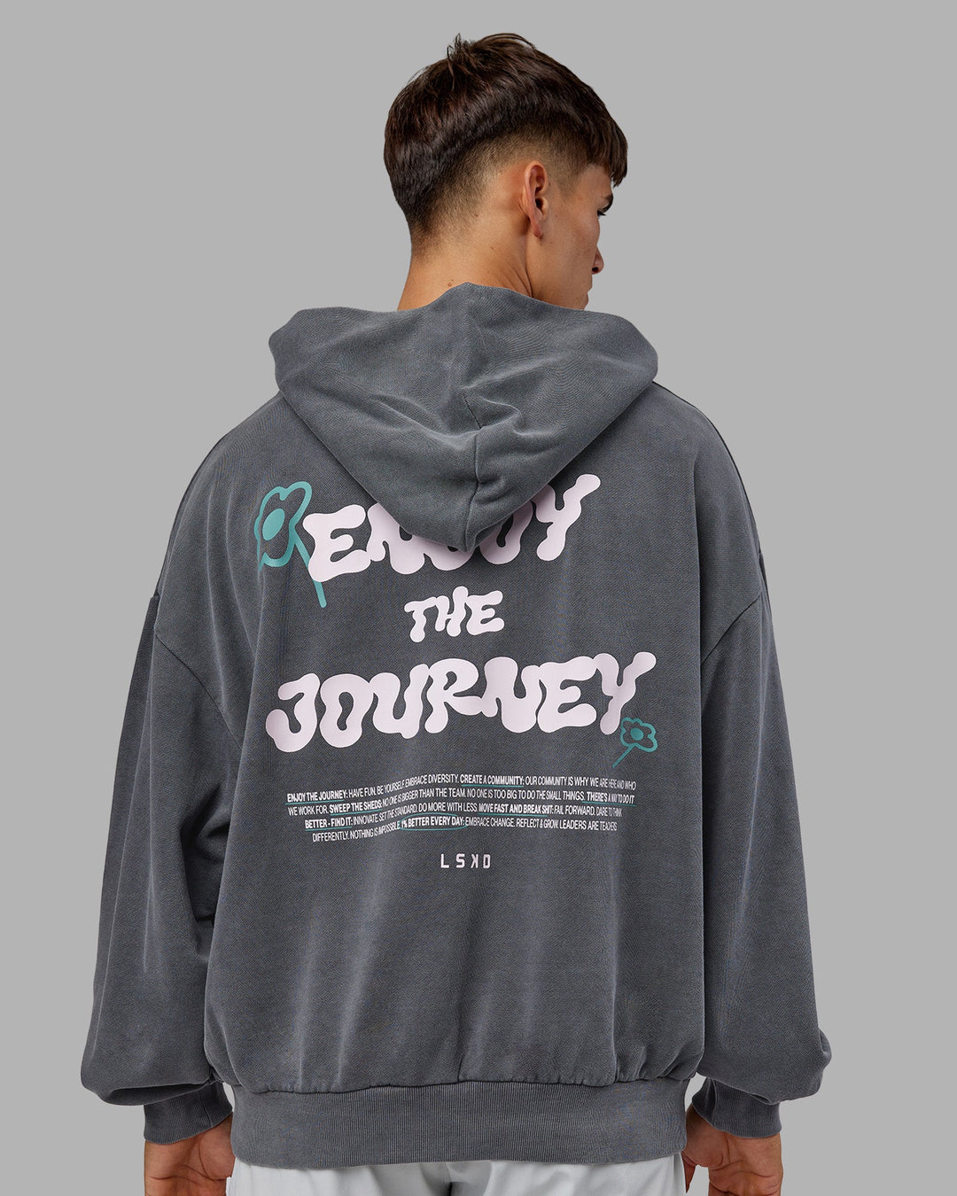 Man wearing ETJ Values Washed Unisex Oversize Hoodie - Dark Storm-Light Bubblegum | Model:Jackson | Size:L