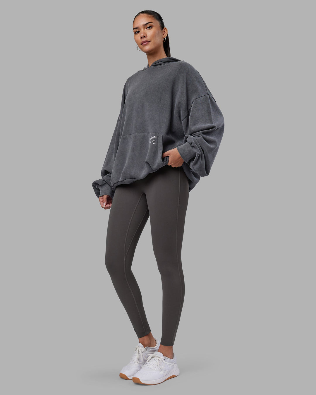 Woman wearing ETJ Values Washed Unisex Oversize Hoodie - Dark Storm-Light Bubblegum | Model:Rhiley | Size:L