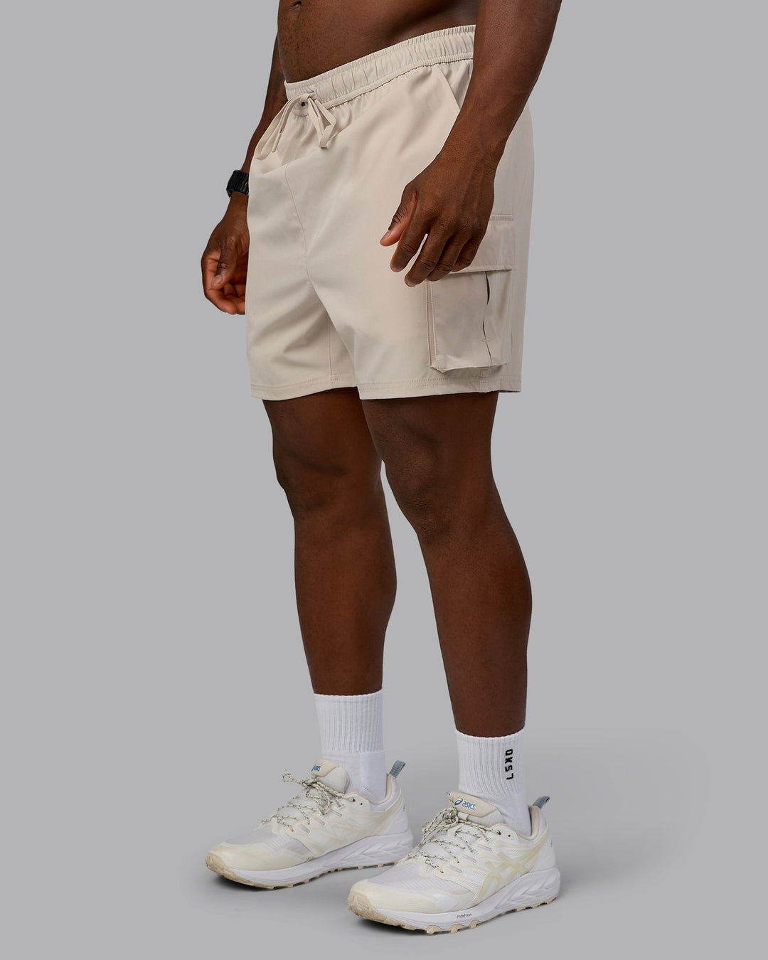 Man wearing Energy Stretch Performance Cargo Short in Shale Beige | Size:L | Model:Sam