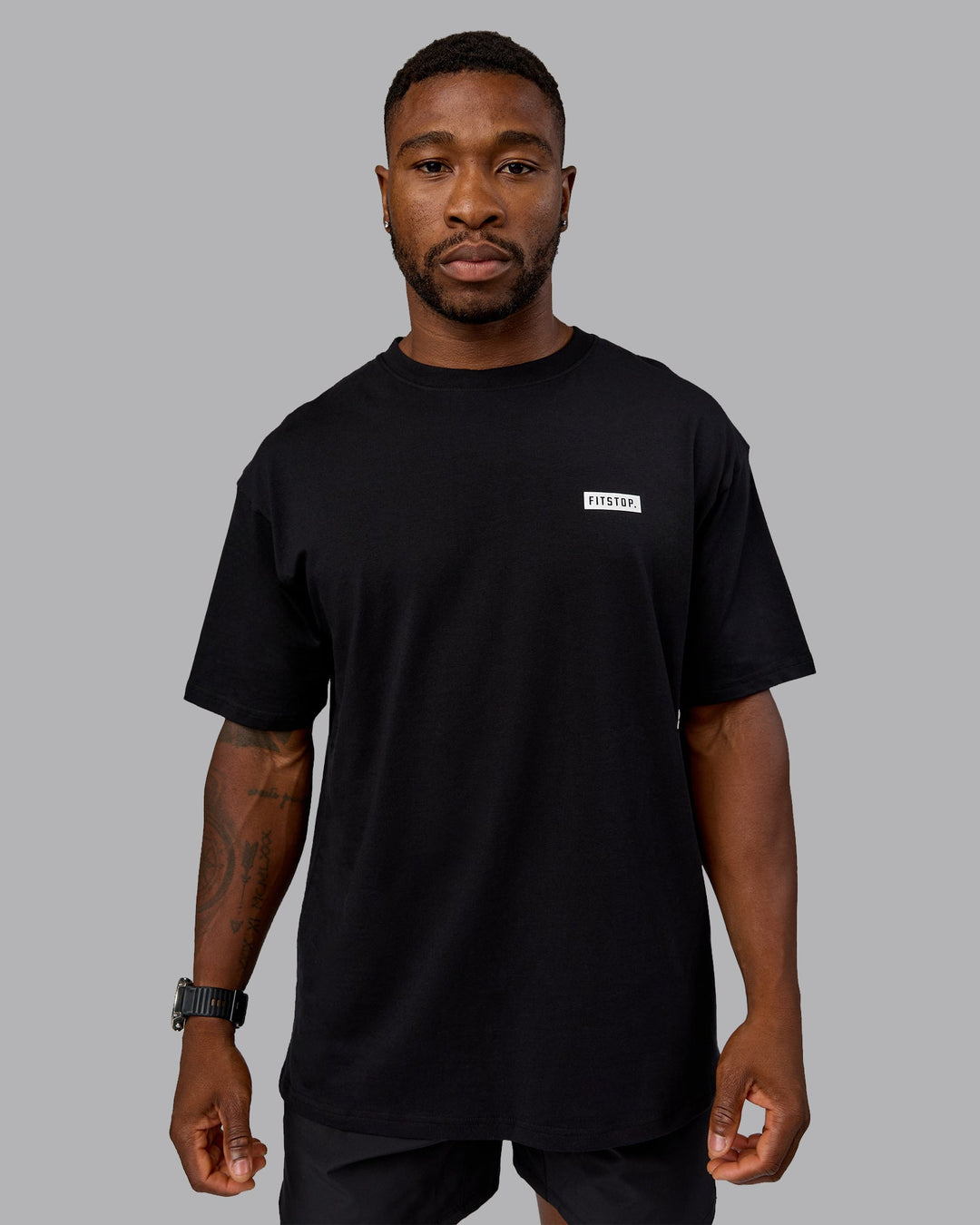 Man wearing Fitstop Embrace the Sweat FLXCotton Oversized Tee in Black-White | Size:L