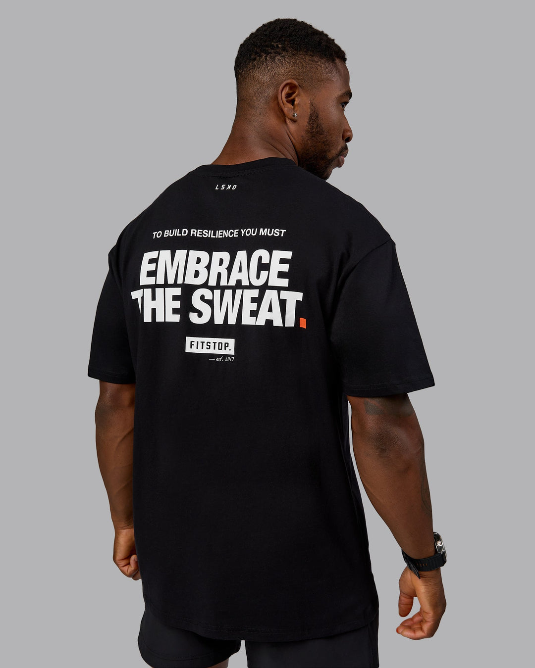 Man wearing Fitstop Embrace the Sweat FLXCotton Oversized Tee in Black-White | Size:L