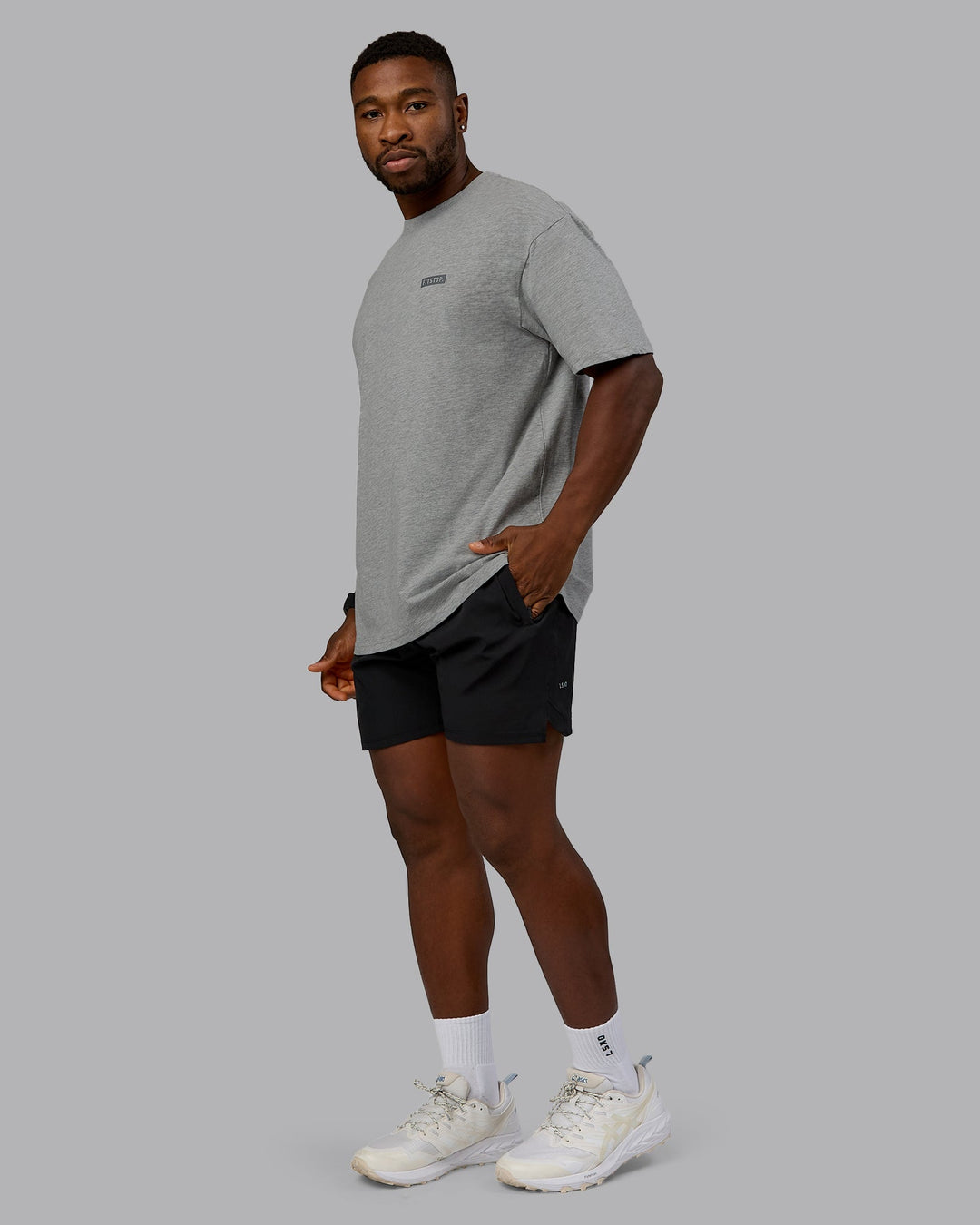 Man wearing Fitstop Embrace the Sweat FLXCotton Oversized Tee in Light Grey Marl-Cool Grey | Size:L