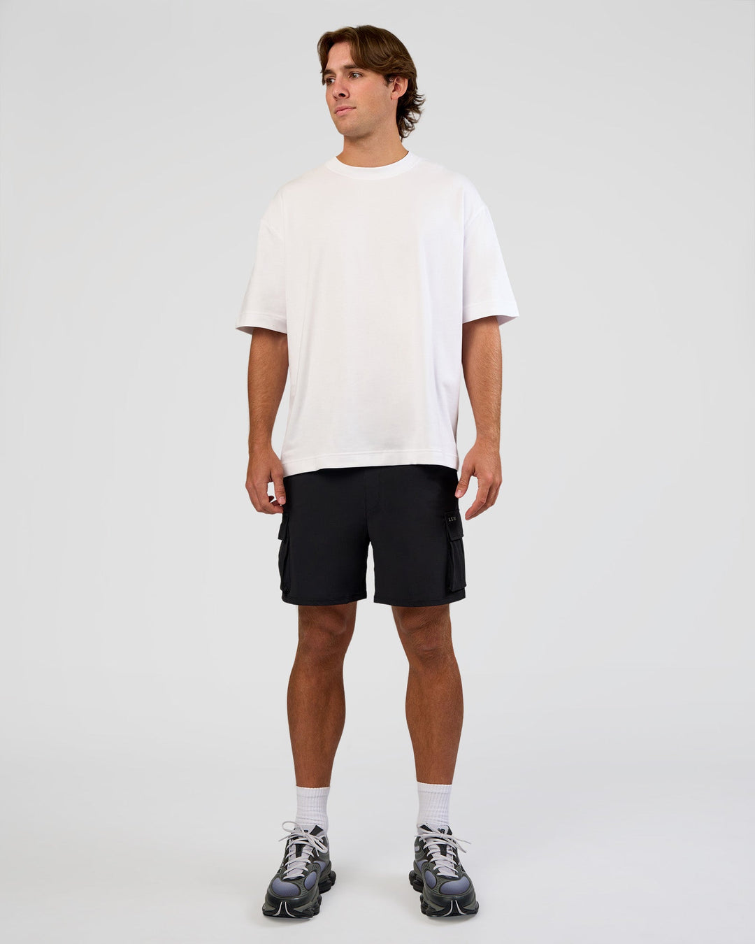 Man wearing Functional Cargo 6" Short - Black | Model:Marcus | Size:L