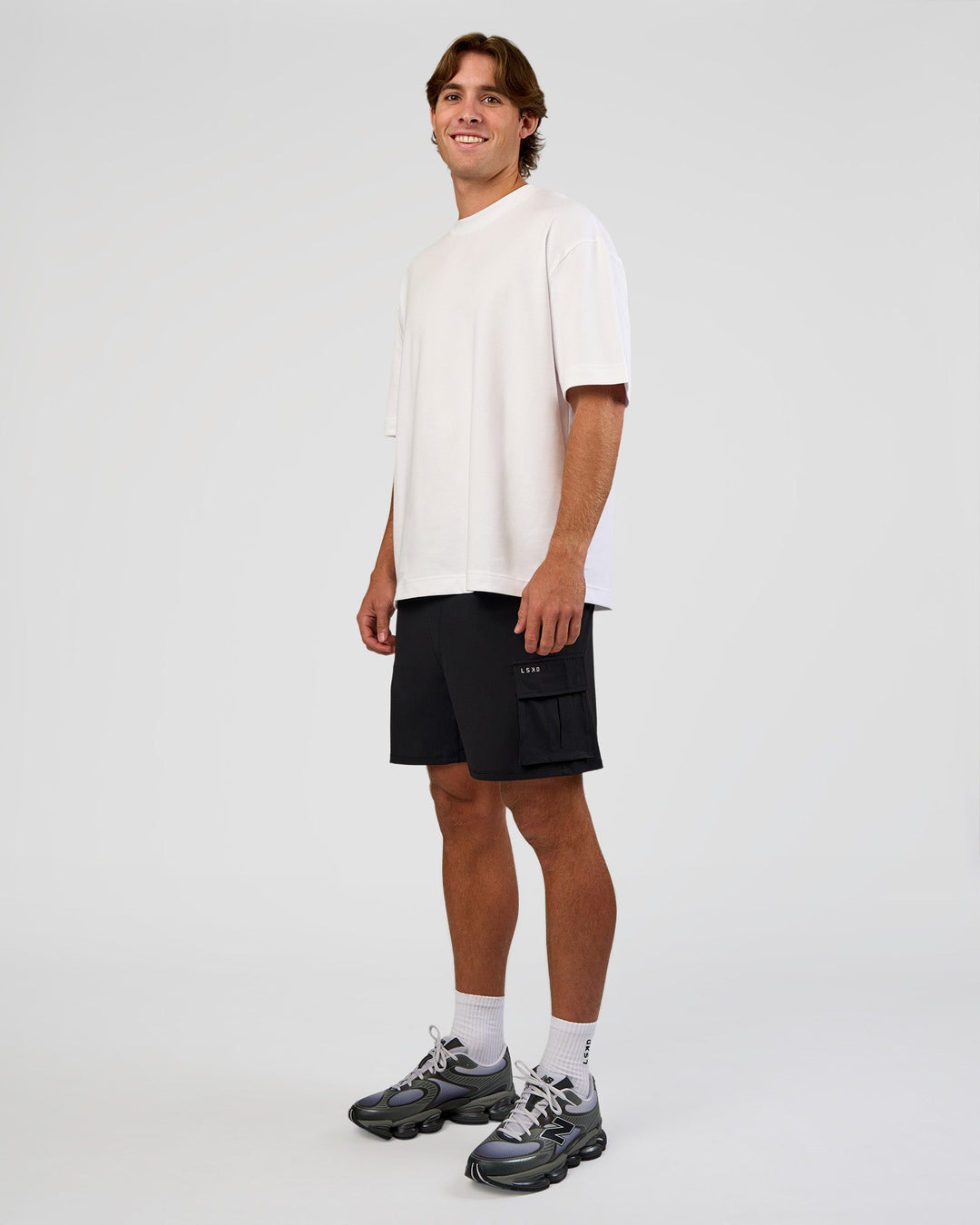 Man wearing Functional Cargo 6" Short - Black | Model:Marcus | Size:L