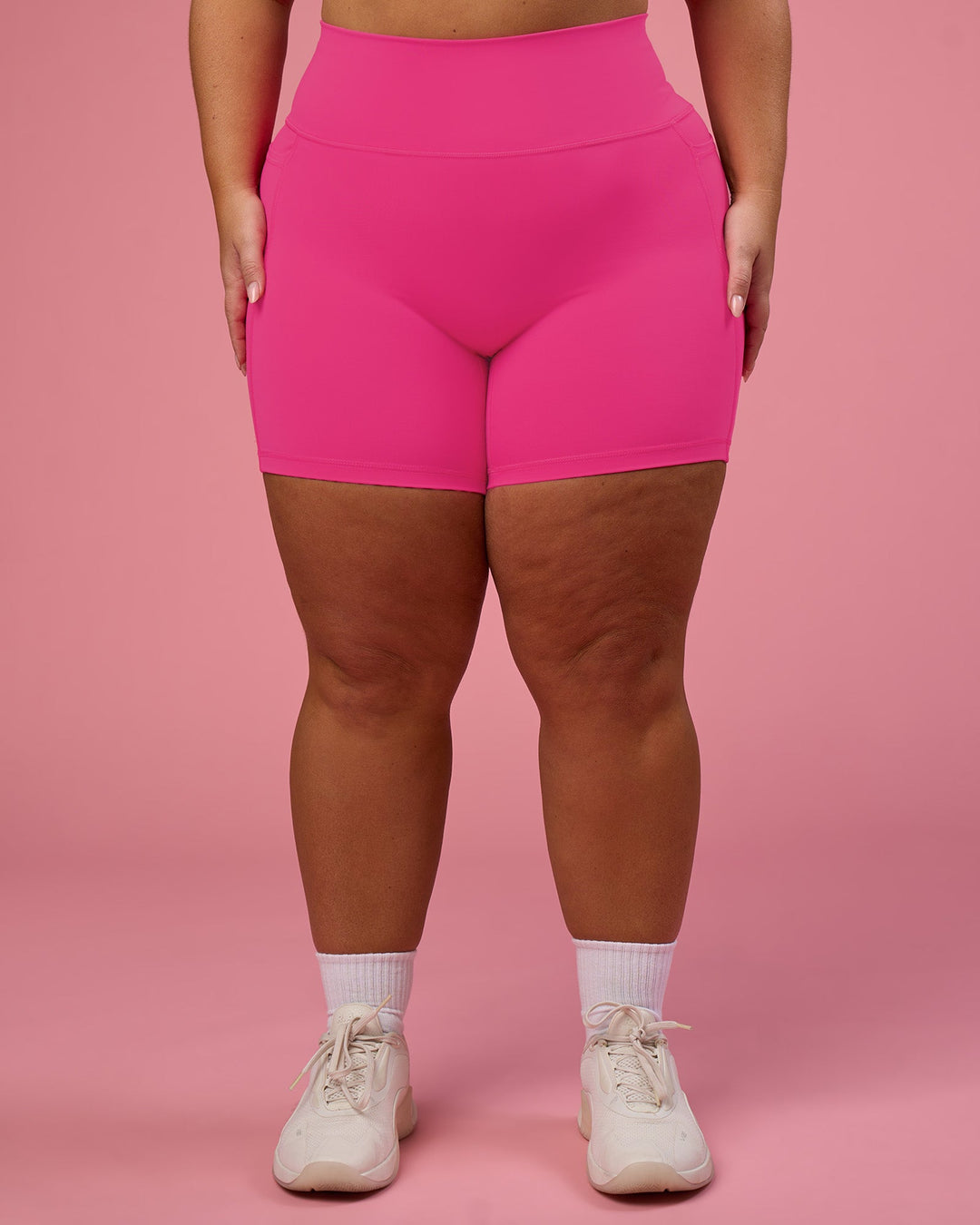 Woman wearing Fusion Ultra High-Rise 6&quot; Short Pockets - Ultra Pink | Model:Bianca | Size:L