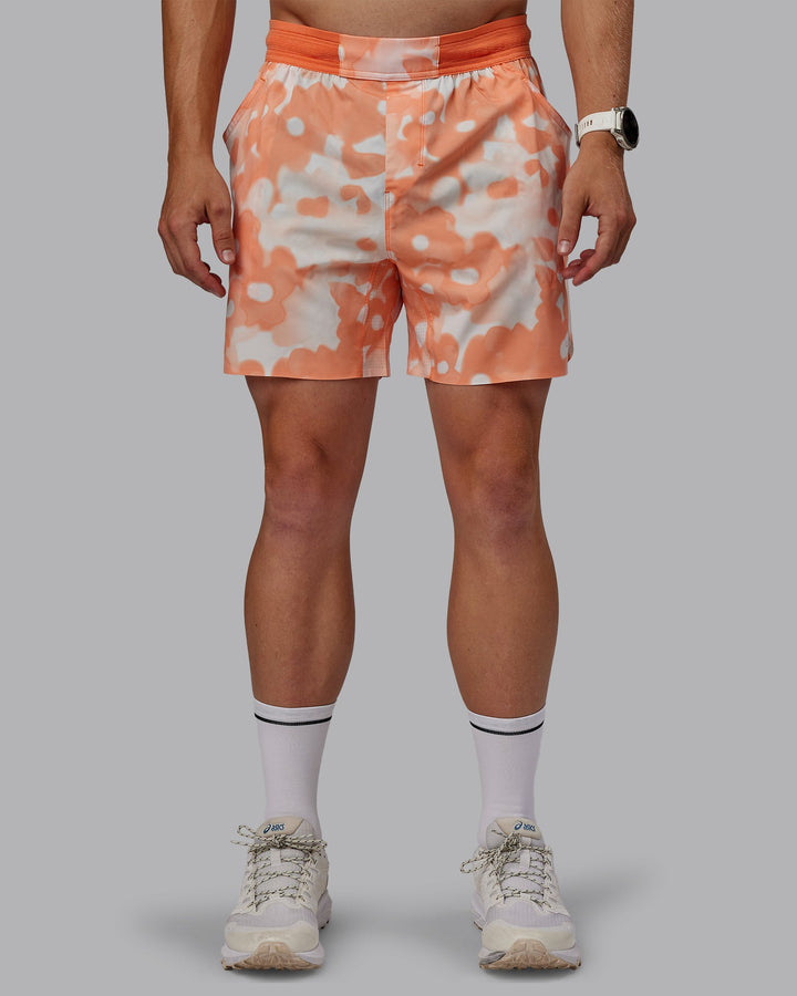 Man wearing Grand Slam 6&quot; Shorts in Wildflower Cantaloupe | Size:L
