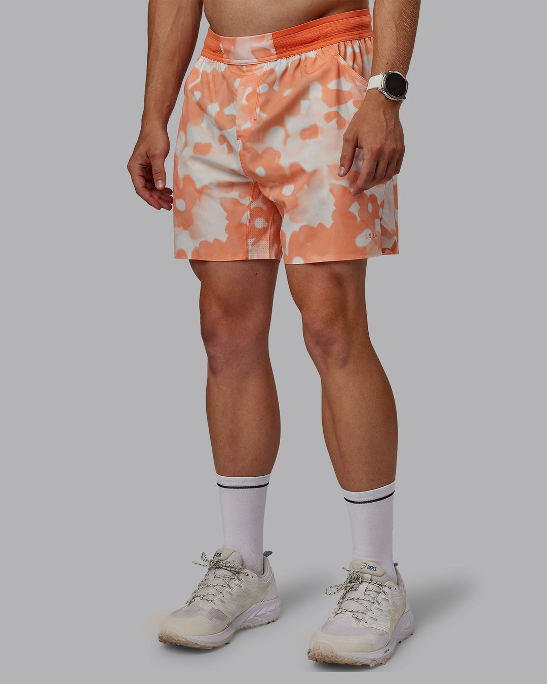 Man wearing Grand Slam 6&quot; Shorts in Wildflower Cantaloupe | Size:L