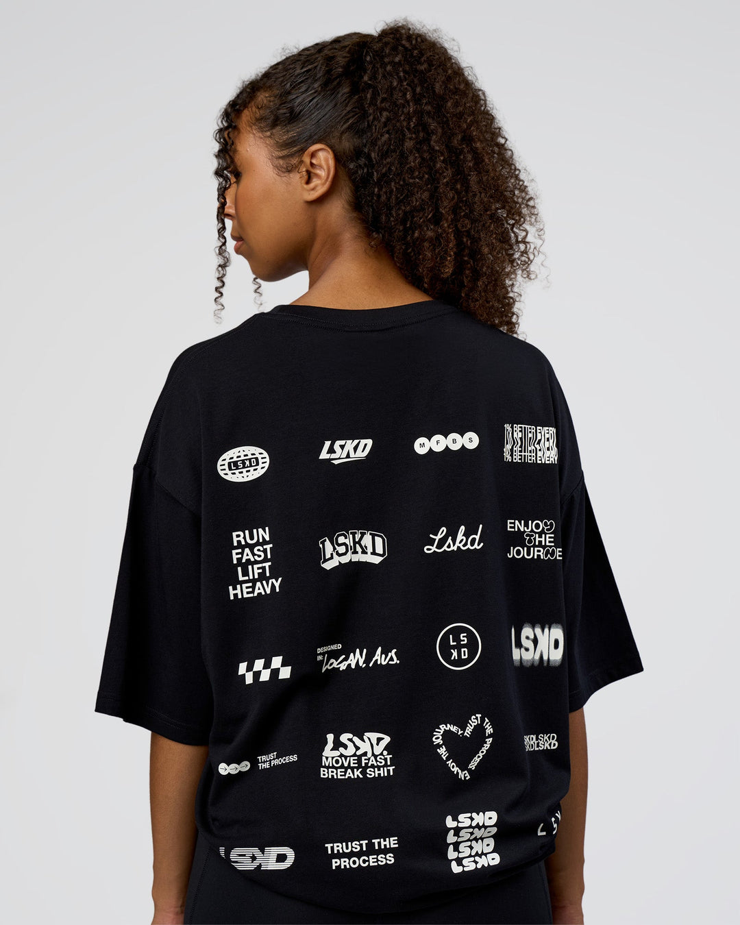 Woman wearing Grid FLXCotton Oversized Tee - Black-White | Model:Jordan | Size:L
