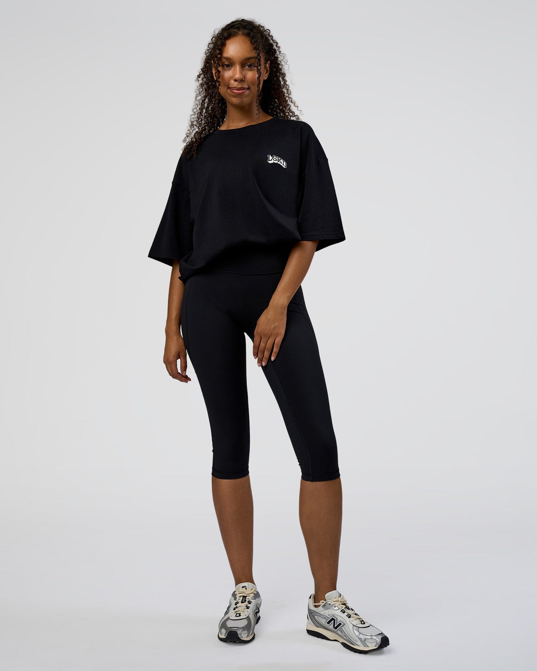 Woman wearing Grid FLXCotton Oversized Tee - Black-White | Model:Jordan | Size:L