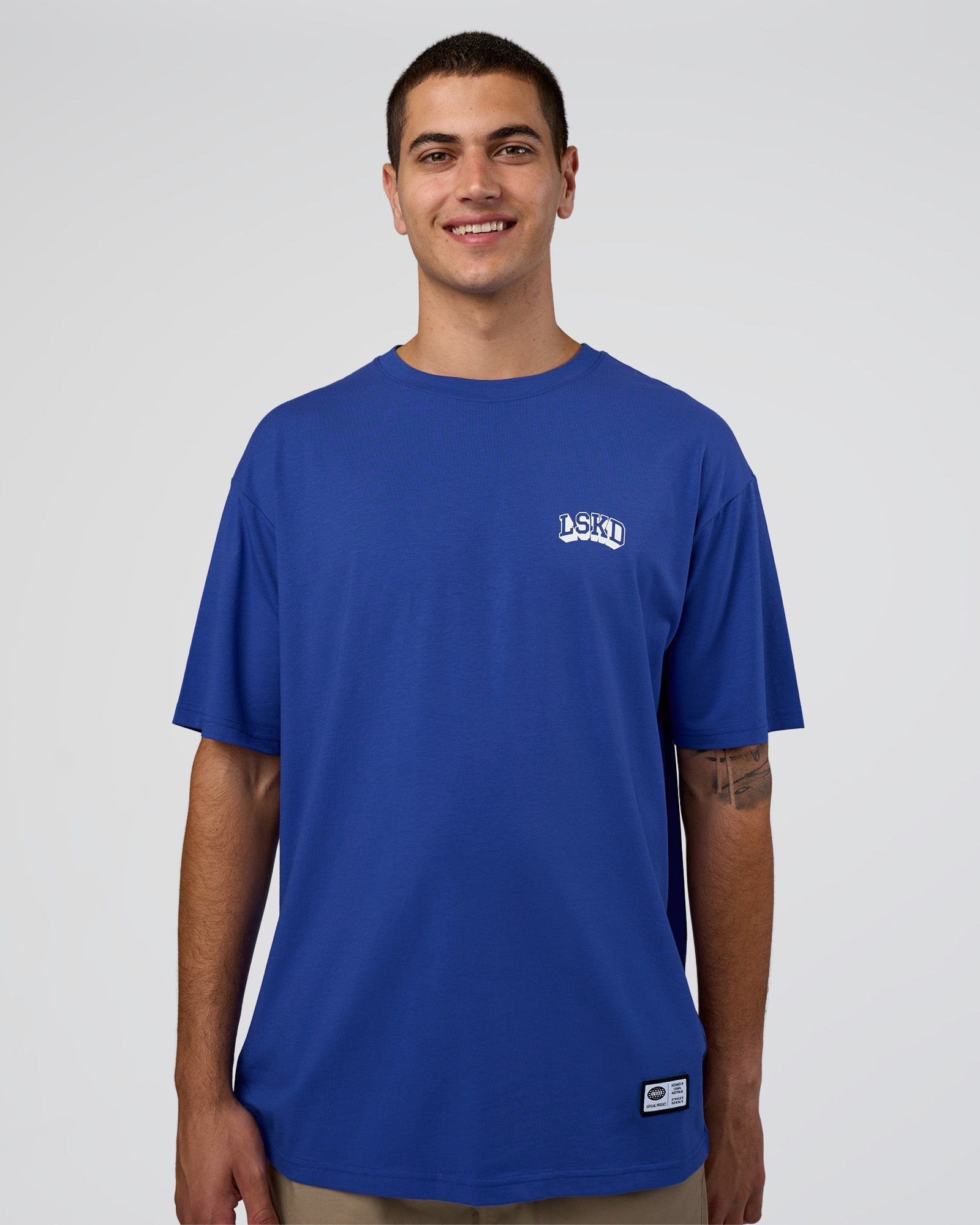 Man wearing Grid FLXCotton Oversized Tee - Power Cobalt-White | Model:Zoran | Size:L